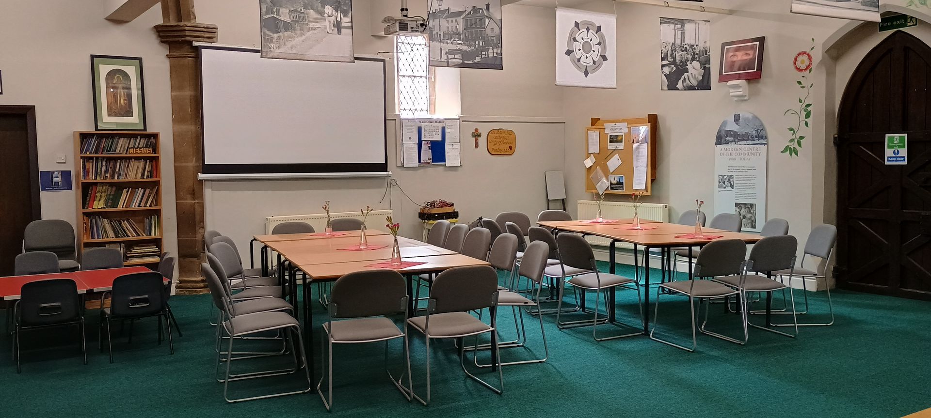 A large room with tables and chairs in it