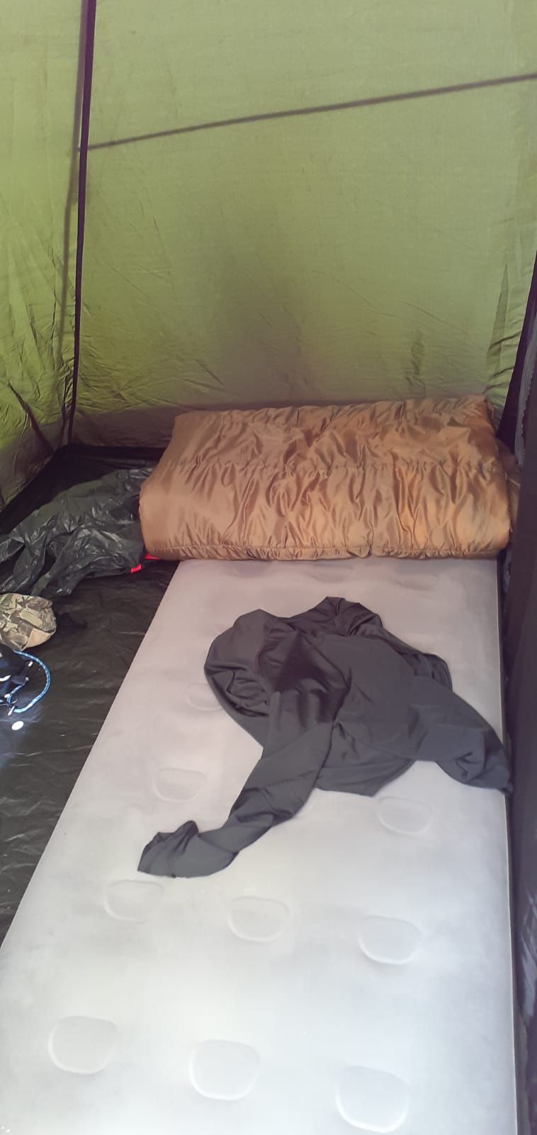 There is a mattress and a pillow in the tent.