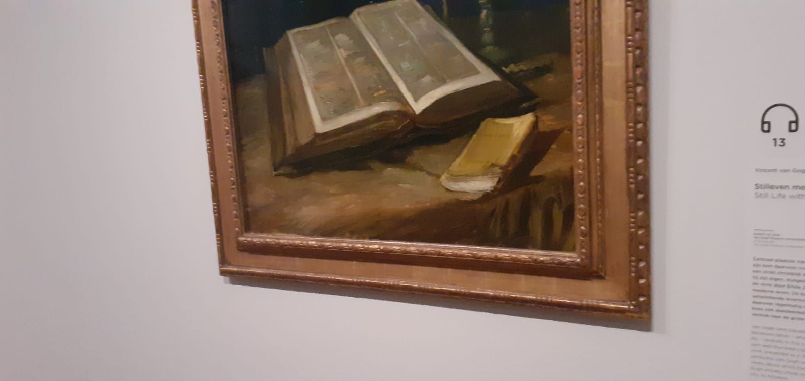 A painting of two books sitting on top of a table.