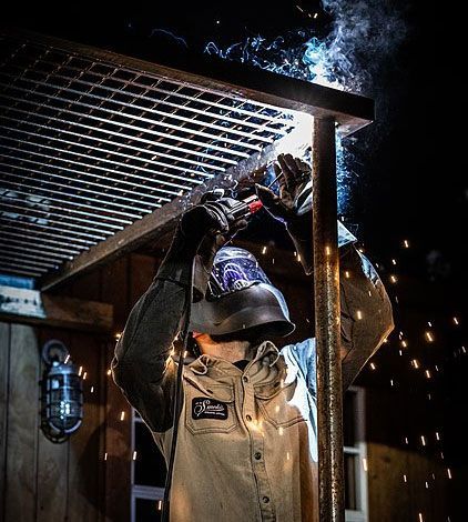 Man Wearing a Welding Helmet is Welding a Metal Structure — Mayric Engineering in Taree, NSW