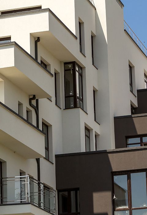 Building With a Lot of Windows and Balconies — Mayric Engineering in Taree, NSW