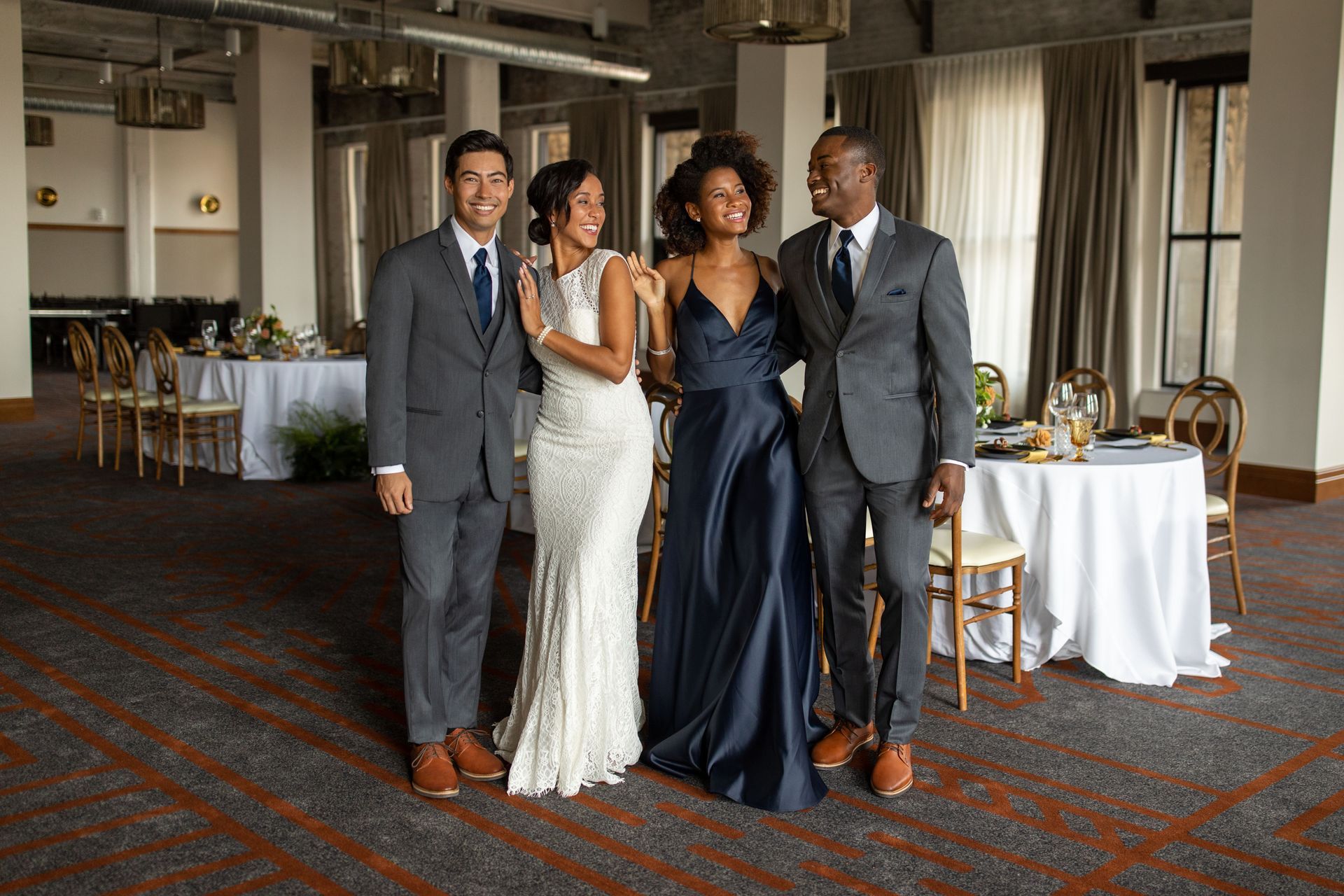 A group of people standing next to each other in a room.