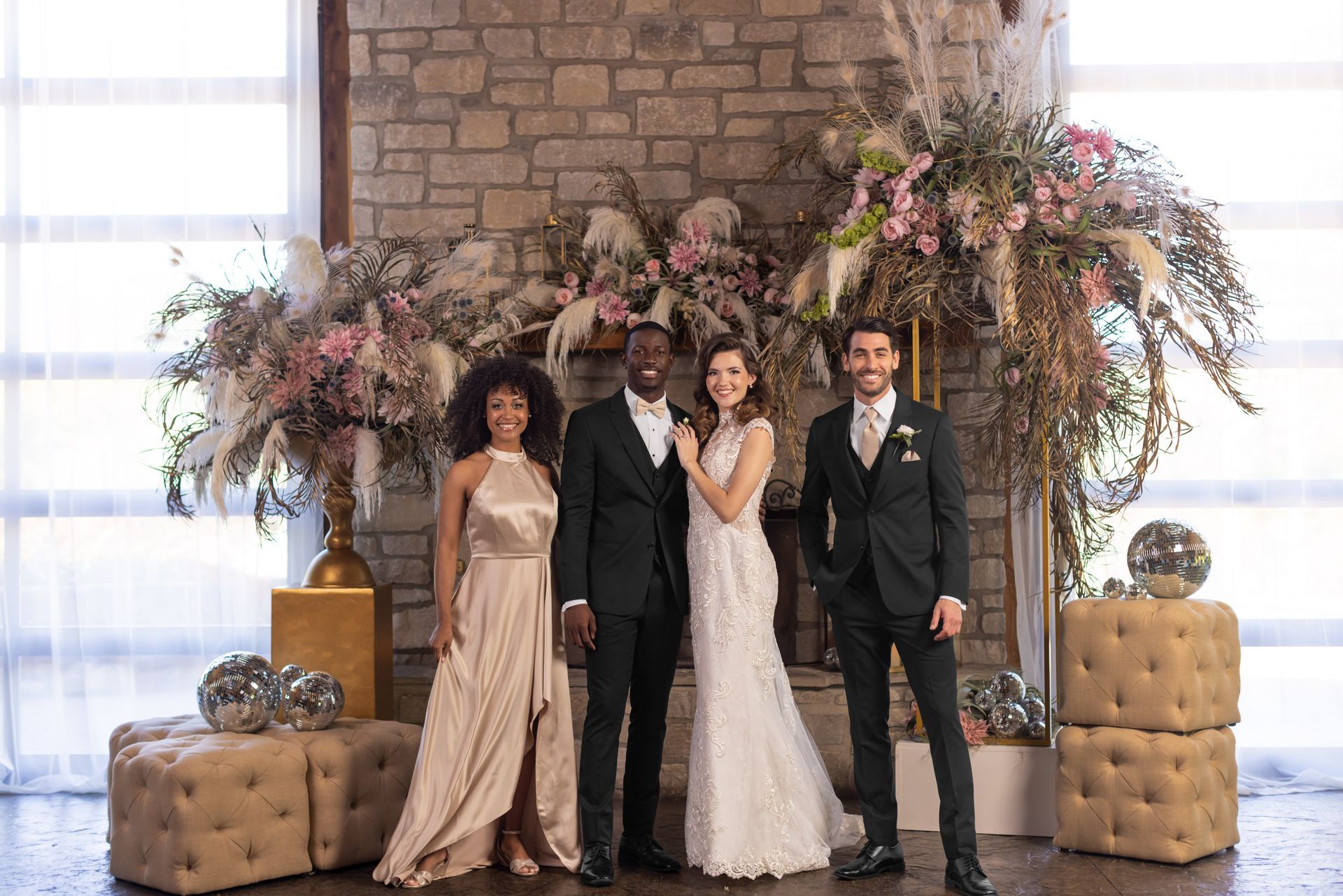 A group of people standing next to each other in front of a fireplace.