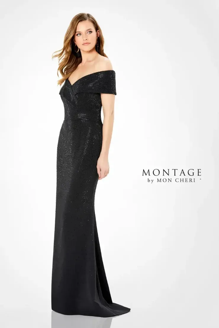 A woman is wearing a black off the shoulder dress.