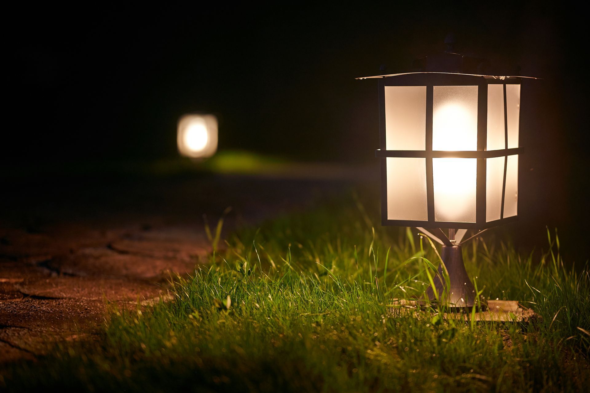Outdoor lighting fixture along a garden pathway near Lexington, SC.