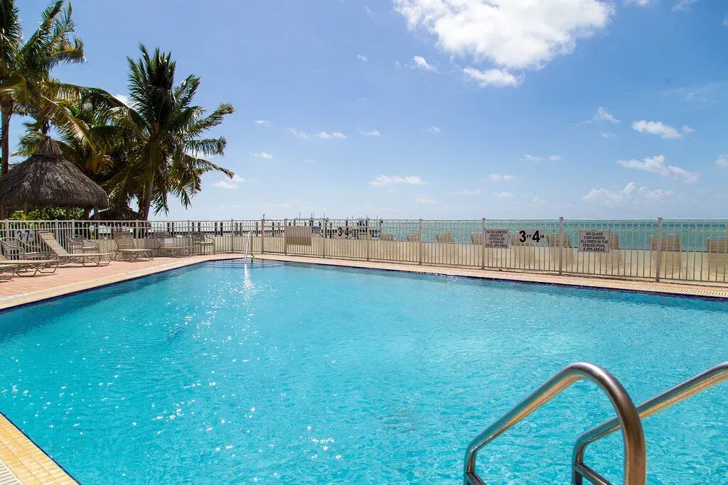 ground view of property zero-edge pool at Coco Plum Beach and Tennis Club and Marina in the Florida Keys