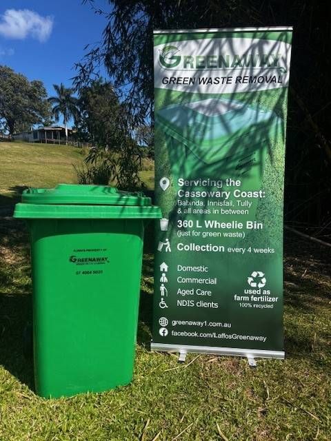 Green Garbage Truck Lifting a Blue Trash Bin to Dump Contents — Greenaway Green Waste Removal in O'Briens Hill, QLD
