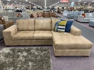 A modern sectional couch arranged at Furniture 'N' More. A modern sectional couch arranged at Furniture 'N' More.