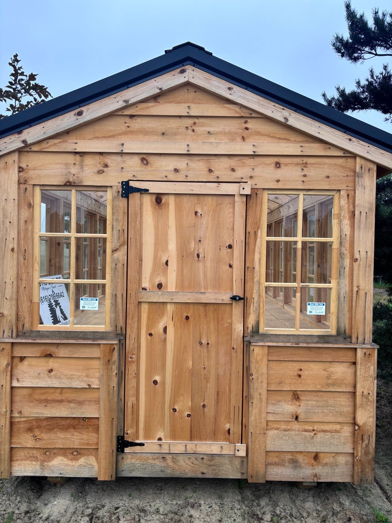 Greenhouse display with front sign