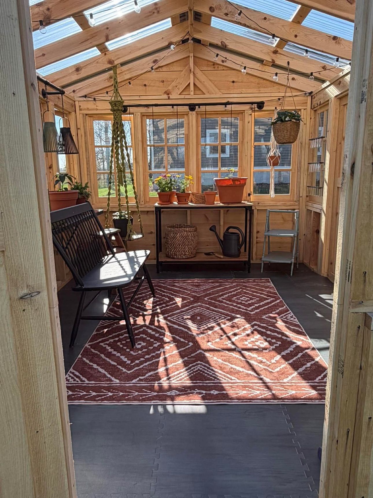 Styled greenhouse interior with rug