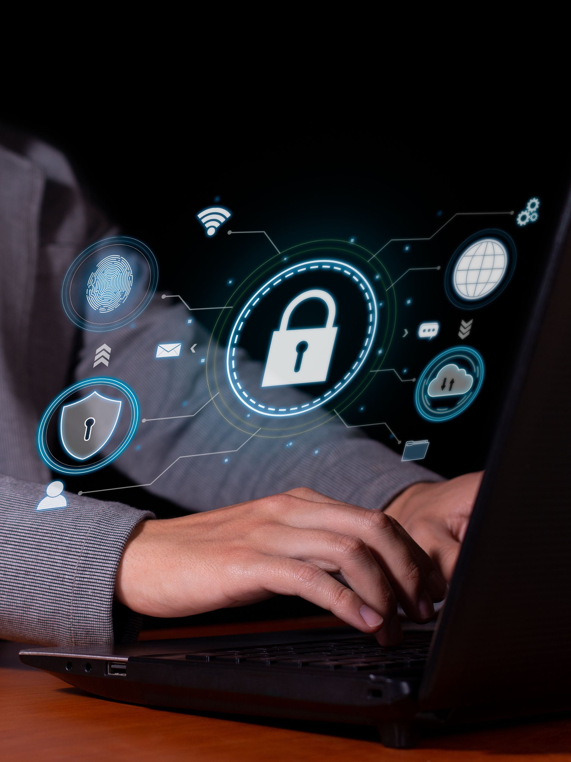 A person is typing on a laptop computer with a padlock on the screen.