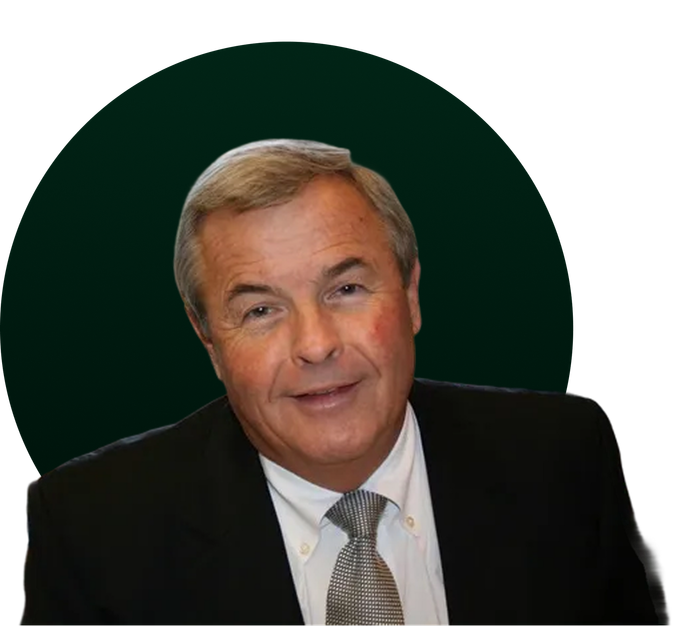 Man in a suit smiles, set against a dark green circle.