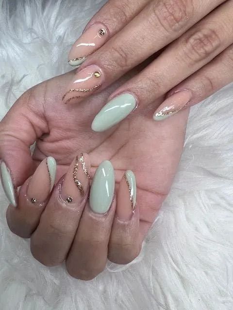 A close up of a woman 's hand with long nails.