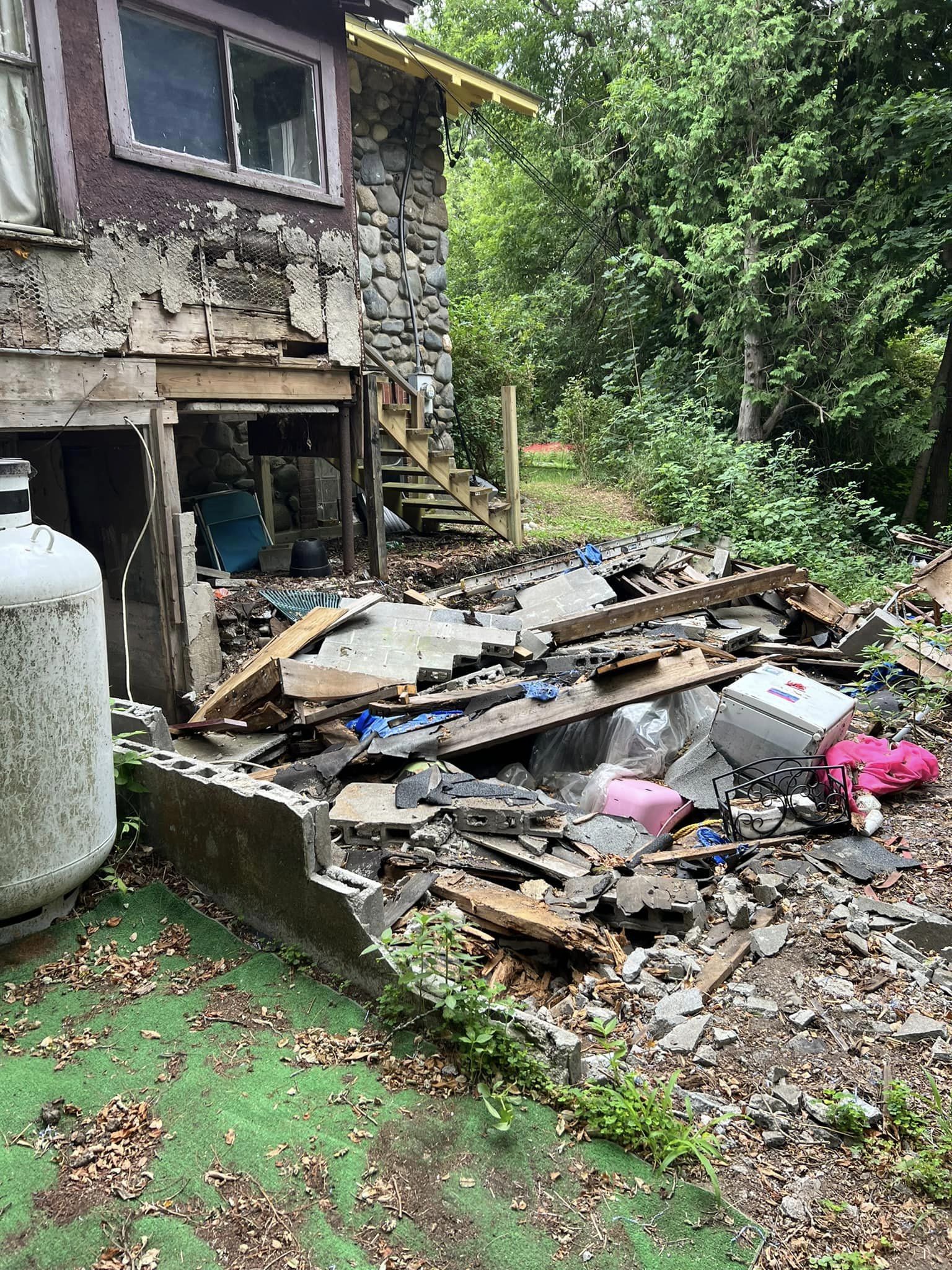 construction debris in yard, property cleanups, construction cleanups, best junk removal services near me, bangor, me, thibodeau services