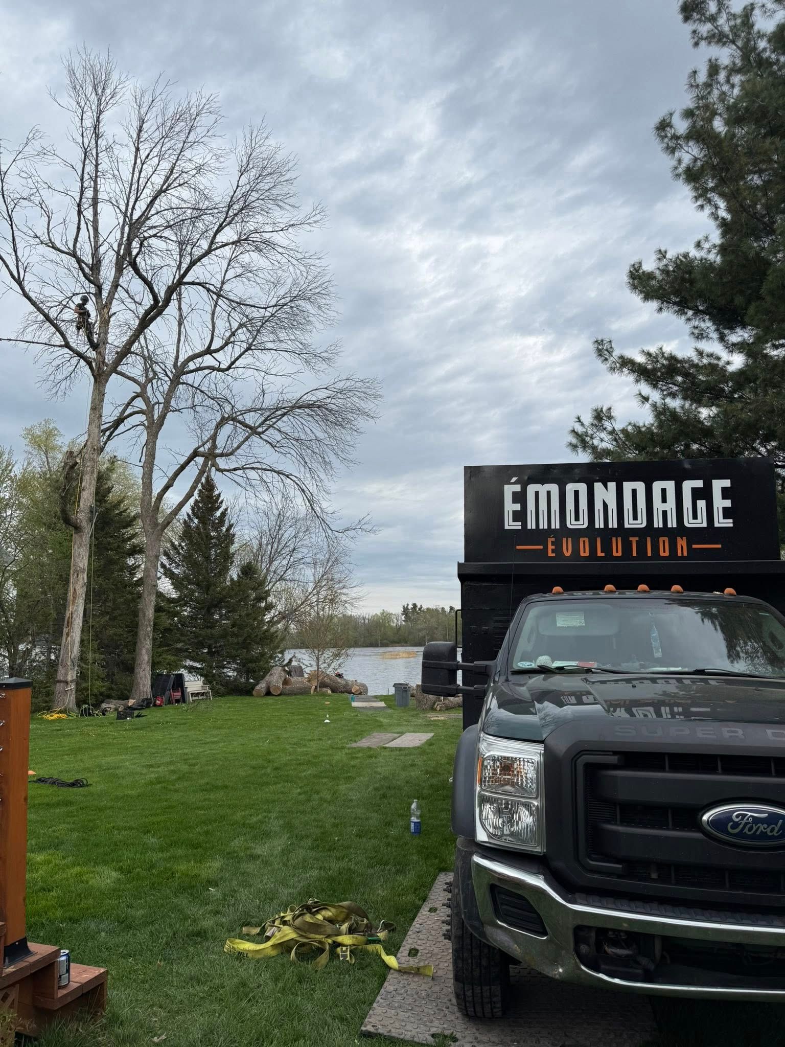 Ford truck with dumpster labeled