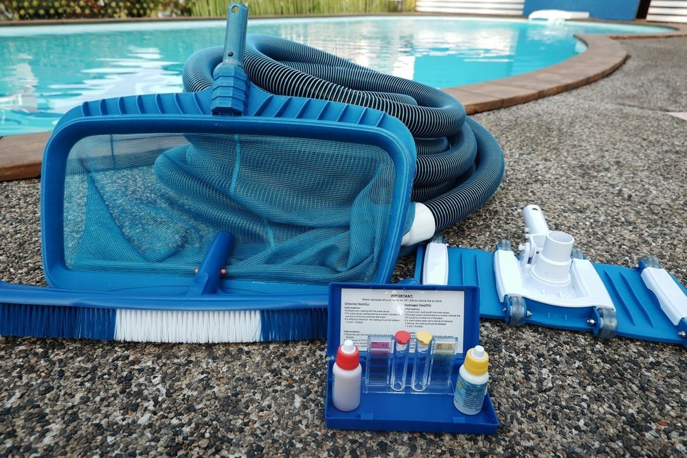 A Pool Cleaning Supplies: Net, Brush, Vacuum, Hose, and Chemical Testing Kit — Cascade Pool & Spa Centre in Wauchope, NSW