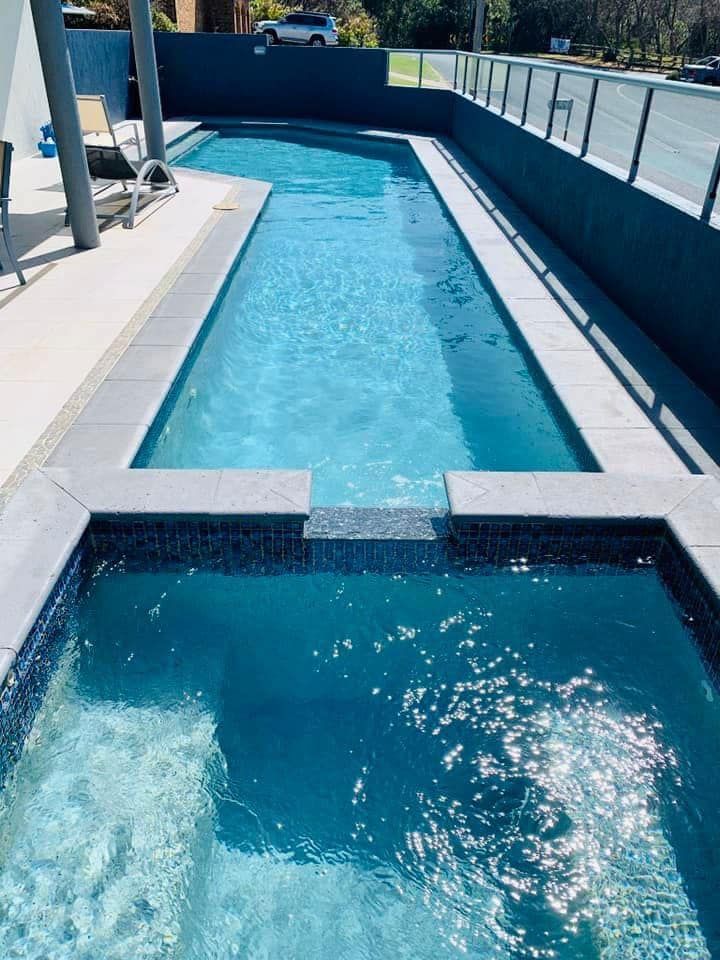 A Yellow Hose Filling Blue and White Patterned Inflatable Pool With Water — Cascade Pool & Spa Centre in Port Macquarie, NSW