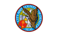 Official seal of the City and County of Denver featuring a large eagle, a gold key, and a building dome.
