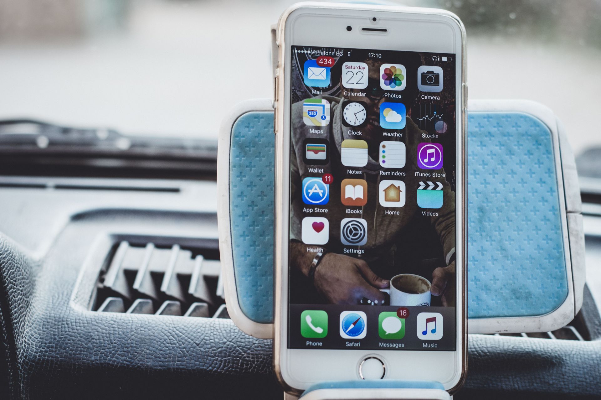 A smartphone and laptop available for submitting a maintenance request.