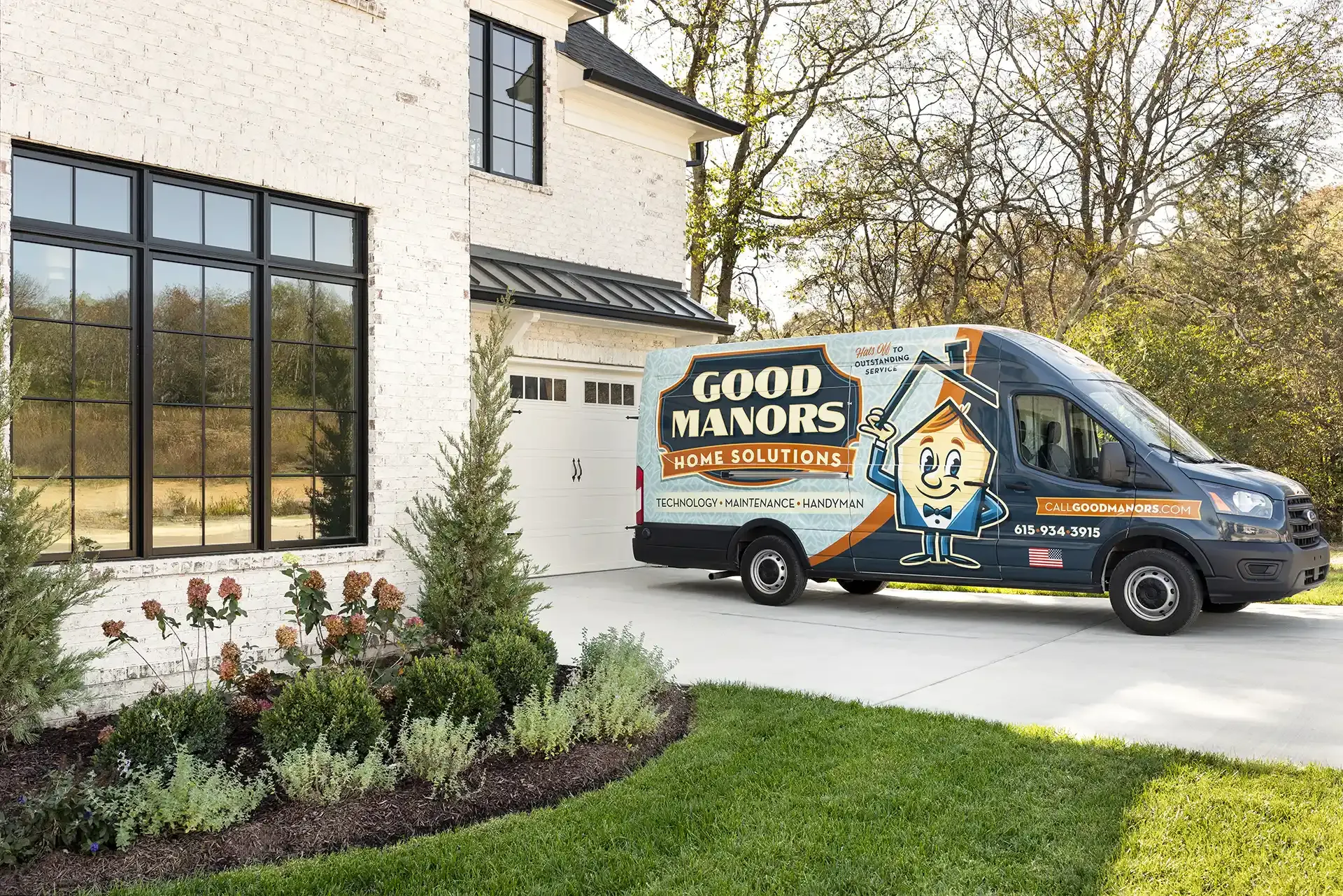 Van parked in front of a house, advertising 