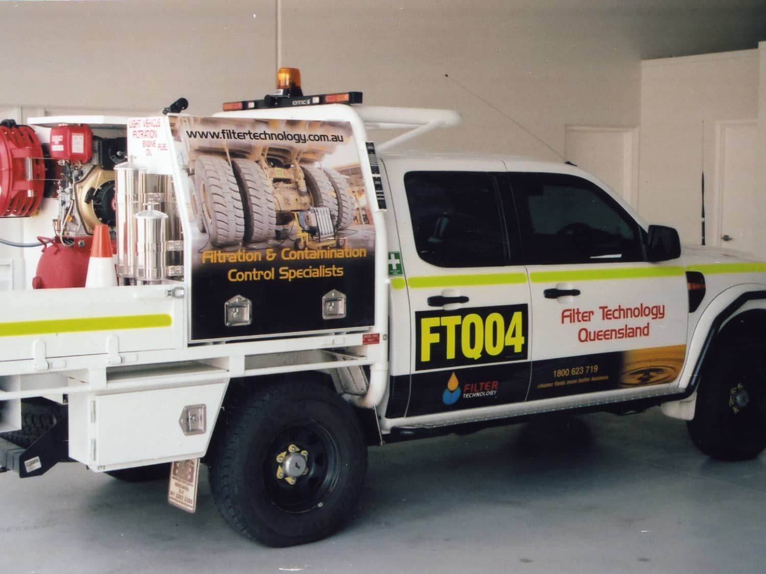 A white truck with the number ft004 on the side
