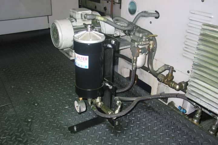 A black container with a white label that says bosch on it