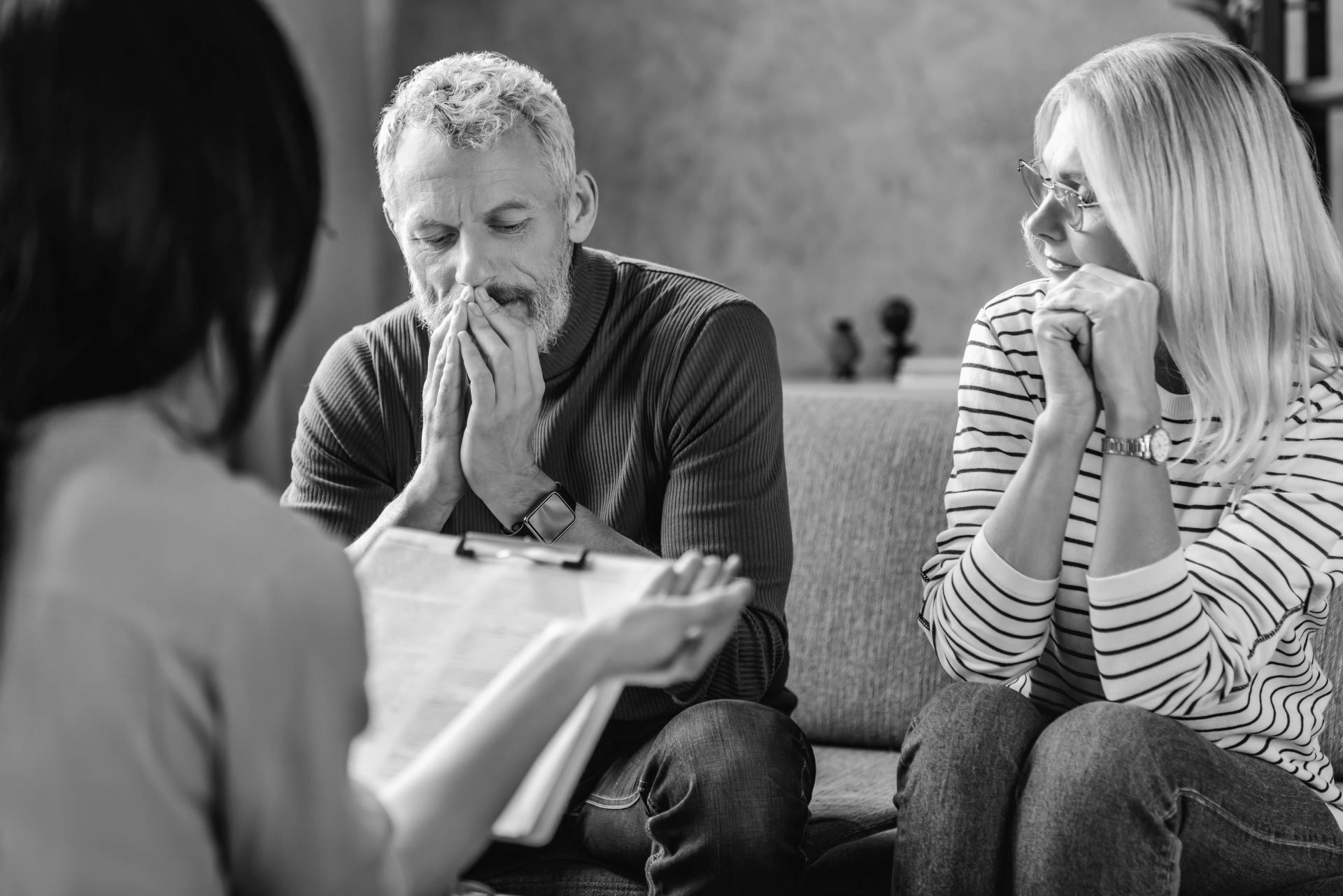 couple sitting with financial advisor