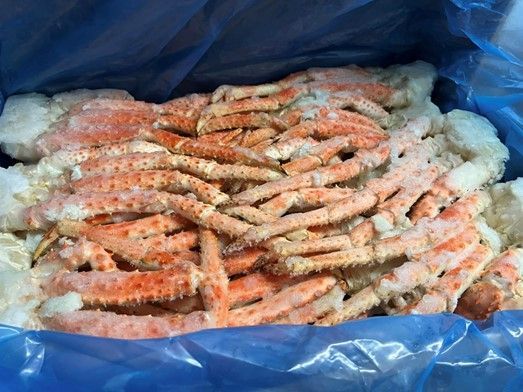 A bag of frozen crab legs in a plastic bag.