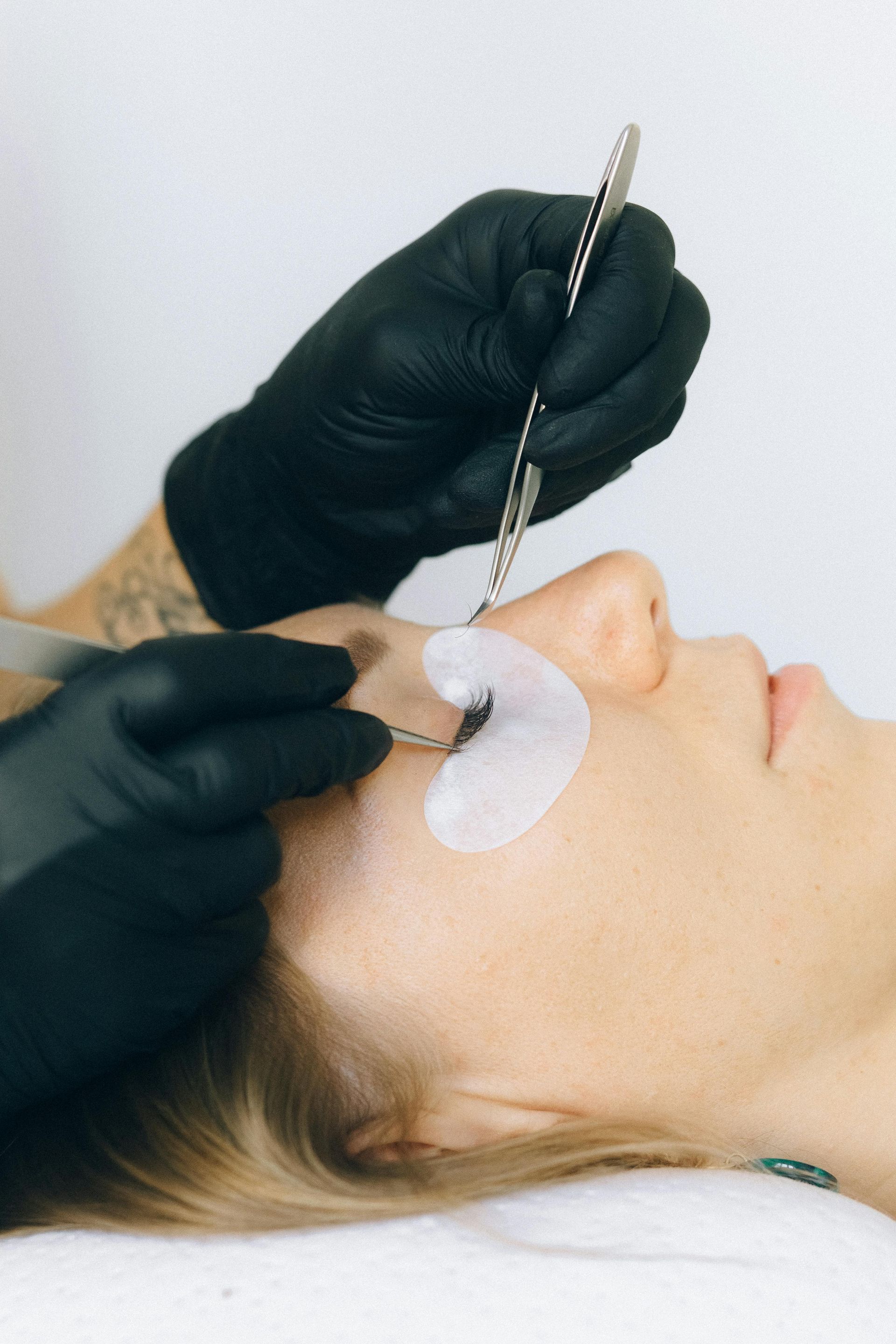 Client getting eyelash extensions at Esthetics by Sam Granger Indiana 