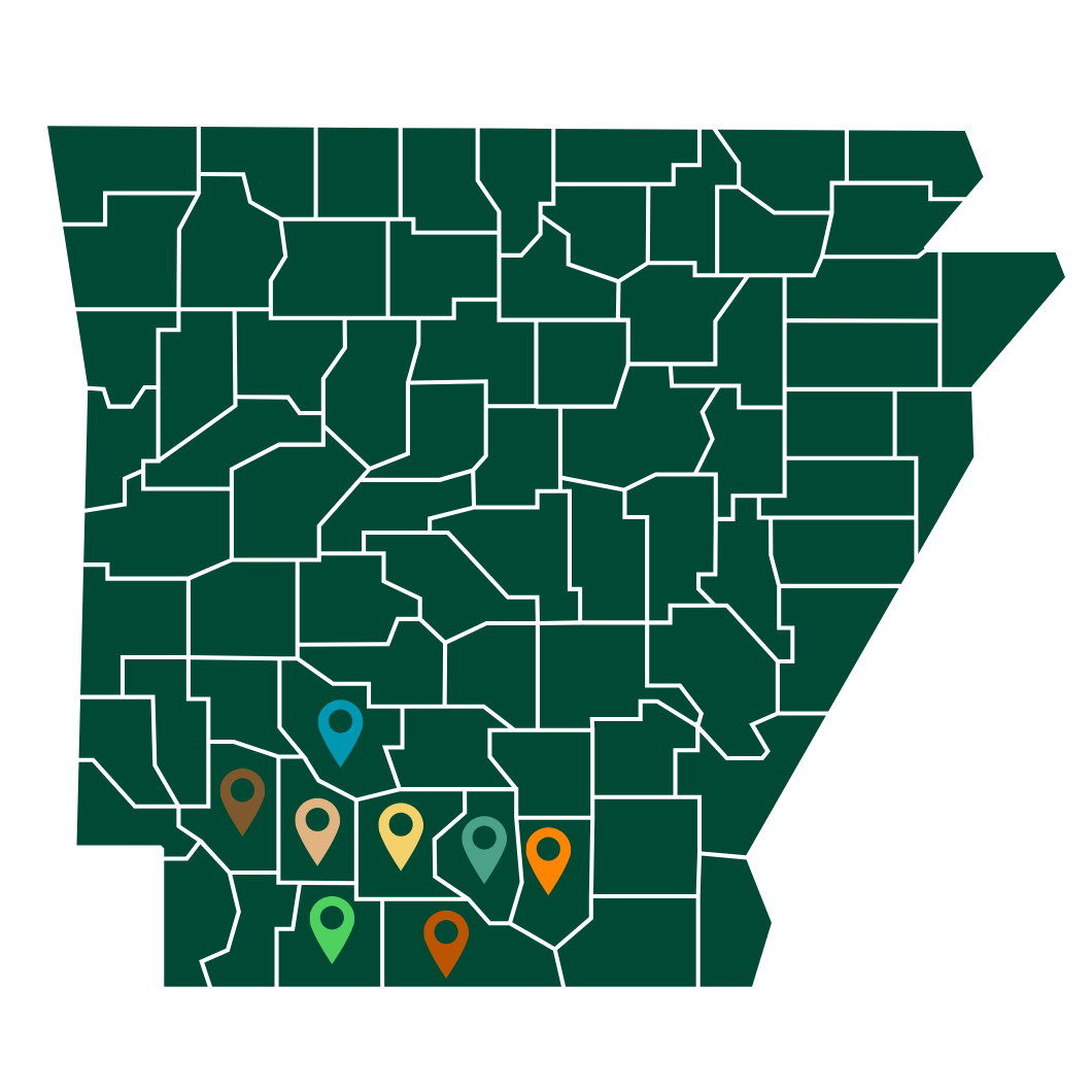 Arkansas county map in dark green with several colored location pins in the south-central area