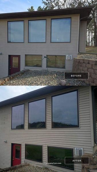 Before and after photos of a house exterior showing windows with dark tinted privacy film applied to the glass.