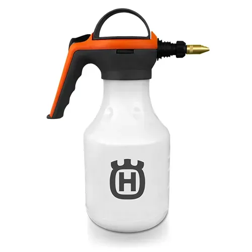 Orange and black garden sprayer bottle with white reservoir and brass nozzle