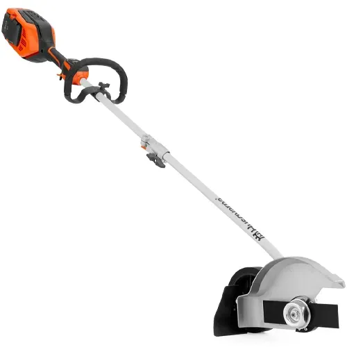Orange-and-black string trimmer with silver shaft and guard on a white background