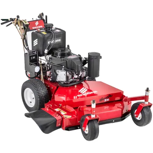 Red commercial zero-turn lawn mower with black engine and front caster wheels on a white background