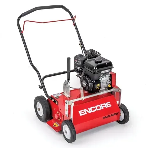 Red Encore stand-on lawn aerator with black engine and handle on white background
