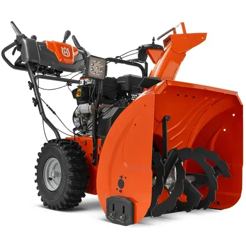 Orange and black snow blower with large front auger, isolated on white background