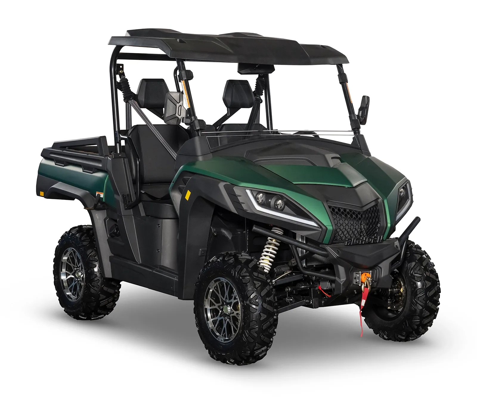 Green and black off-road utility vehicle with roof and cargo bed, isolated on white background