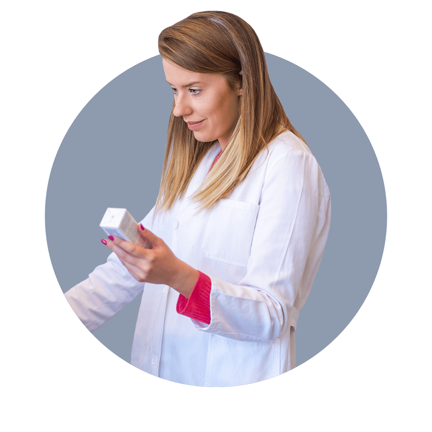 Pharmacist holding medication and looking at computer