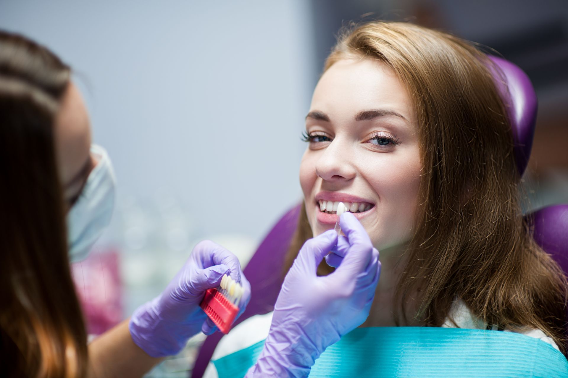Woman having teeth examined