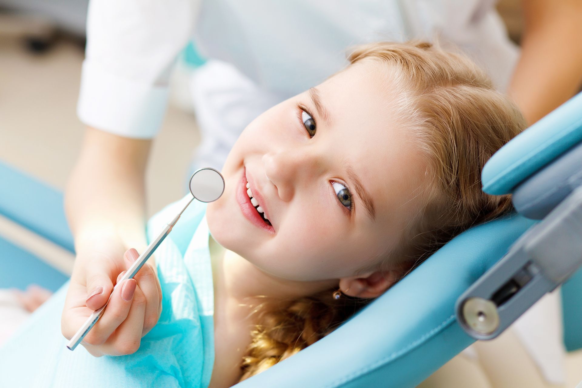Child having teeth worked on by dentist