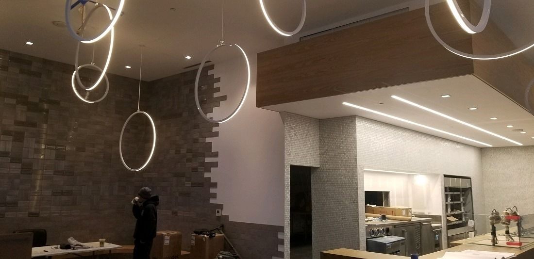 A room with a lot of lights hanging from the ceiling.