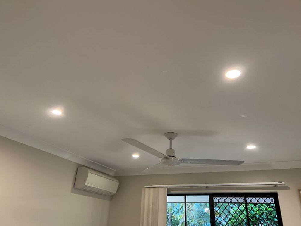 A Living Room With a Ceiling Fan and a Window — AES Electrical Contracting In Winnellie, NT