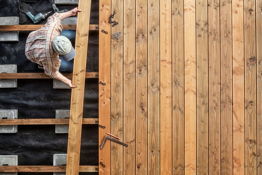 A man is repairing a deck