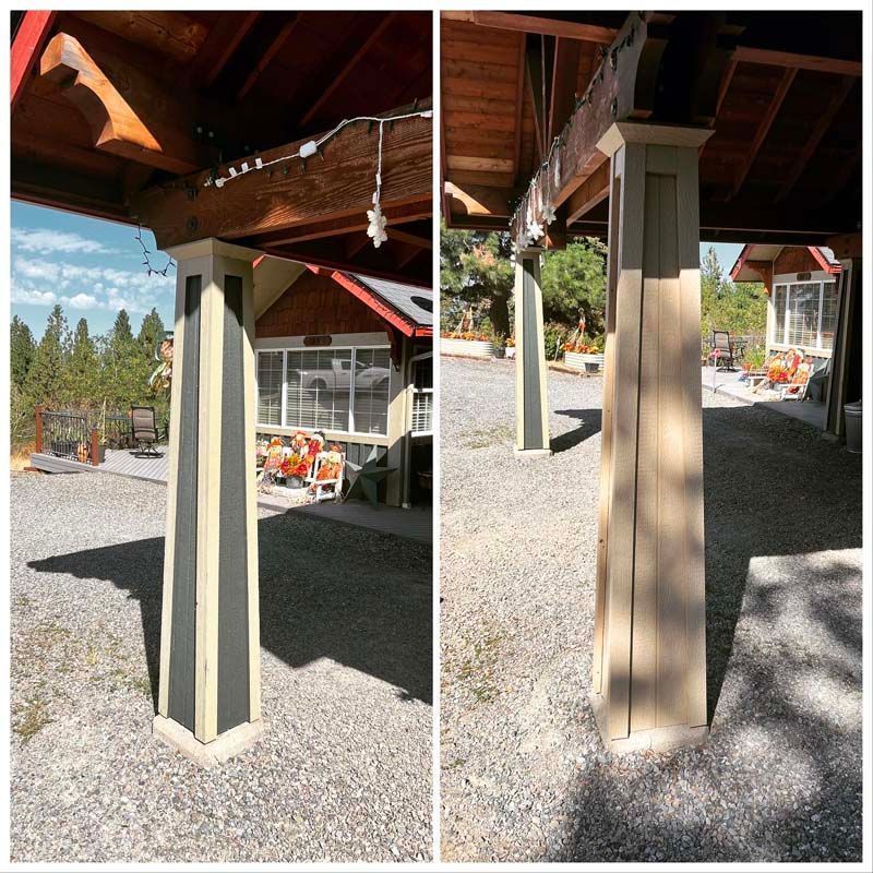 Covered outdoor posts with beige wrap panels supporting a wooden roof over gravel ground.