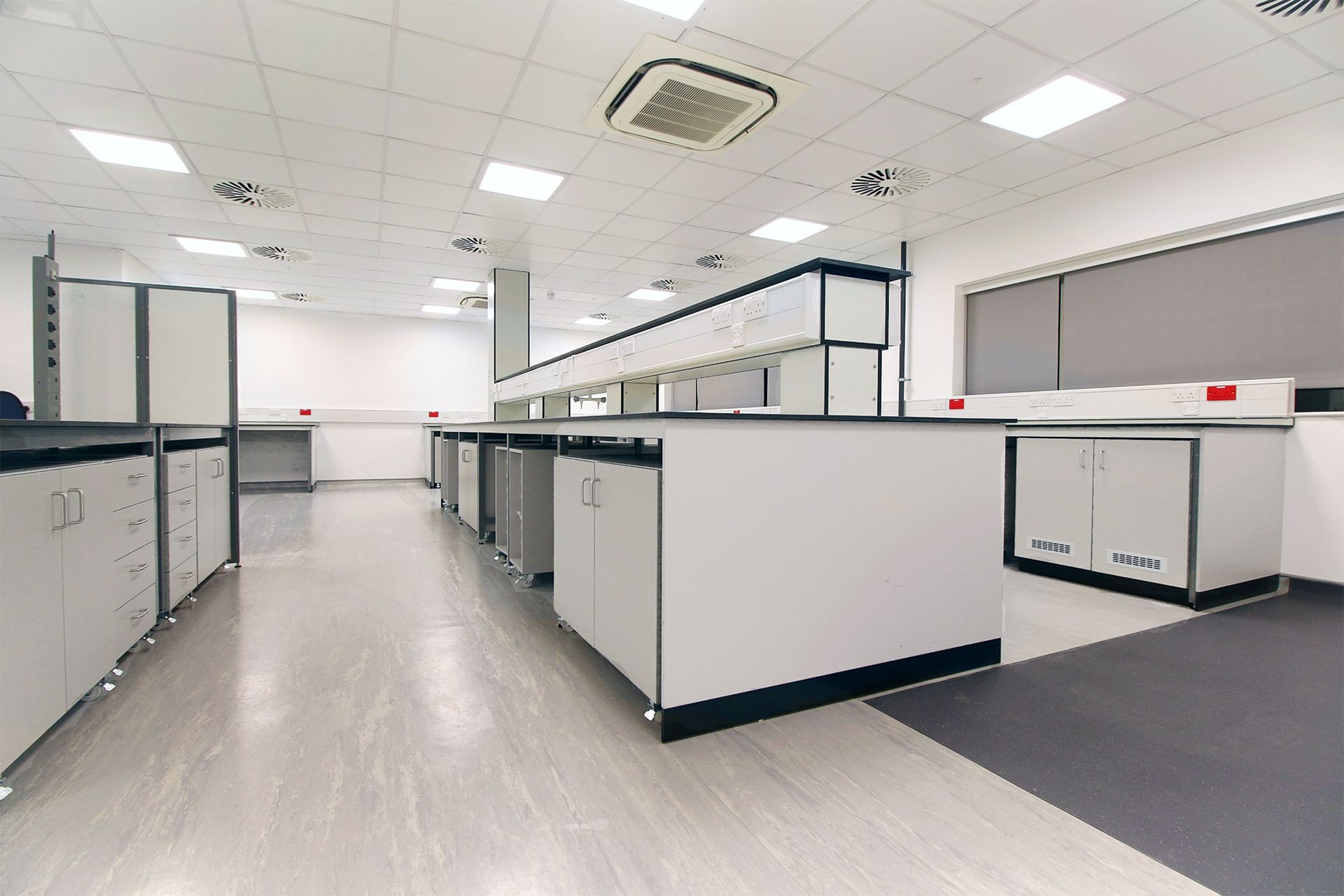 Empty modern office cubicles in a bright open workspace