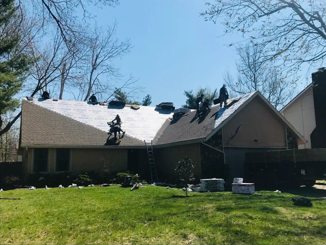 A house with a roof that is being repaired.