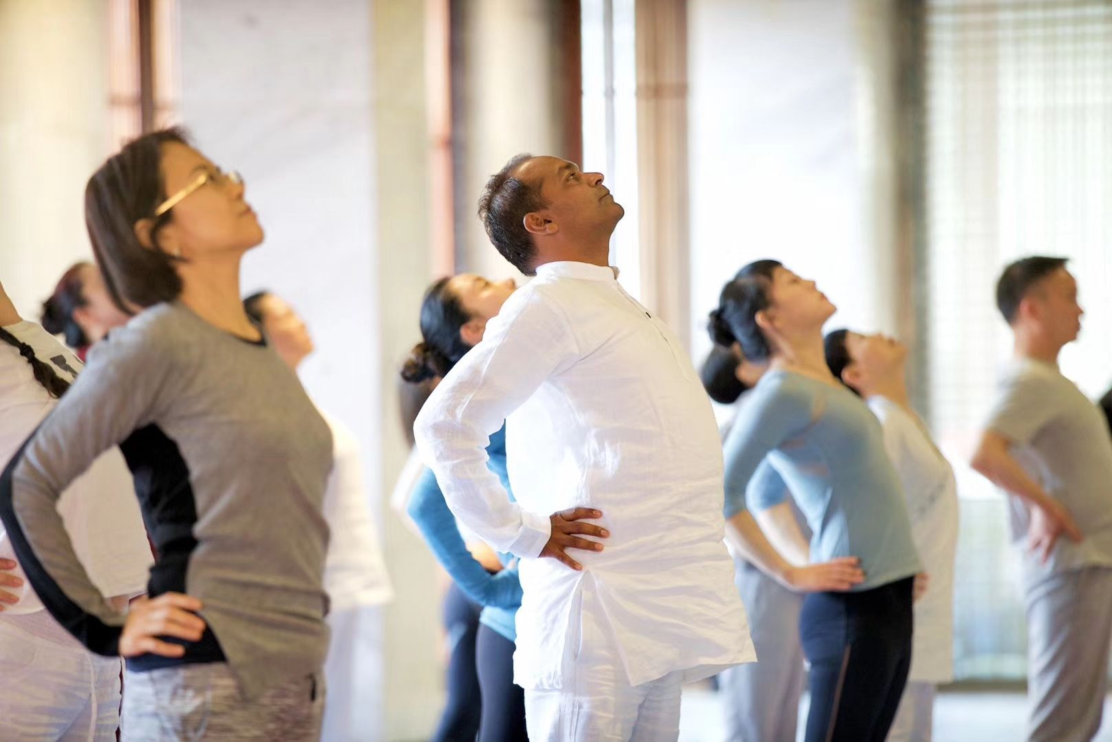 Experienced yoga teacher guiding a class at Soham Retreat