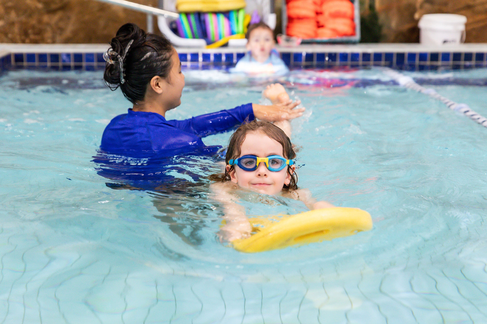 child developing all-round skills through swimming lessons
