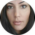 A close up of a woman 's face in a circle.