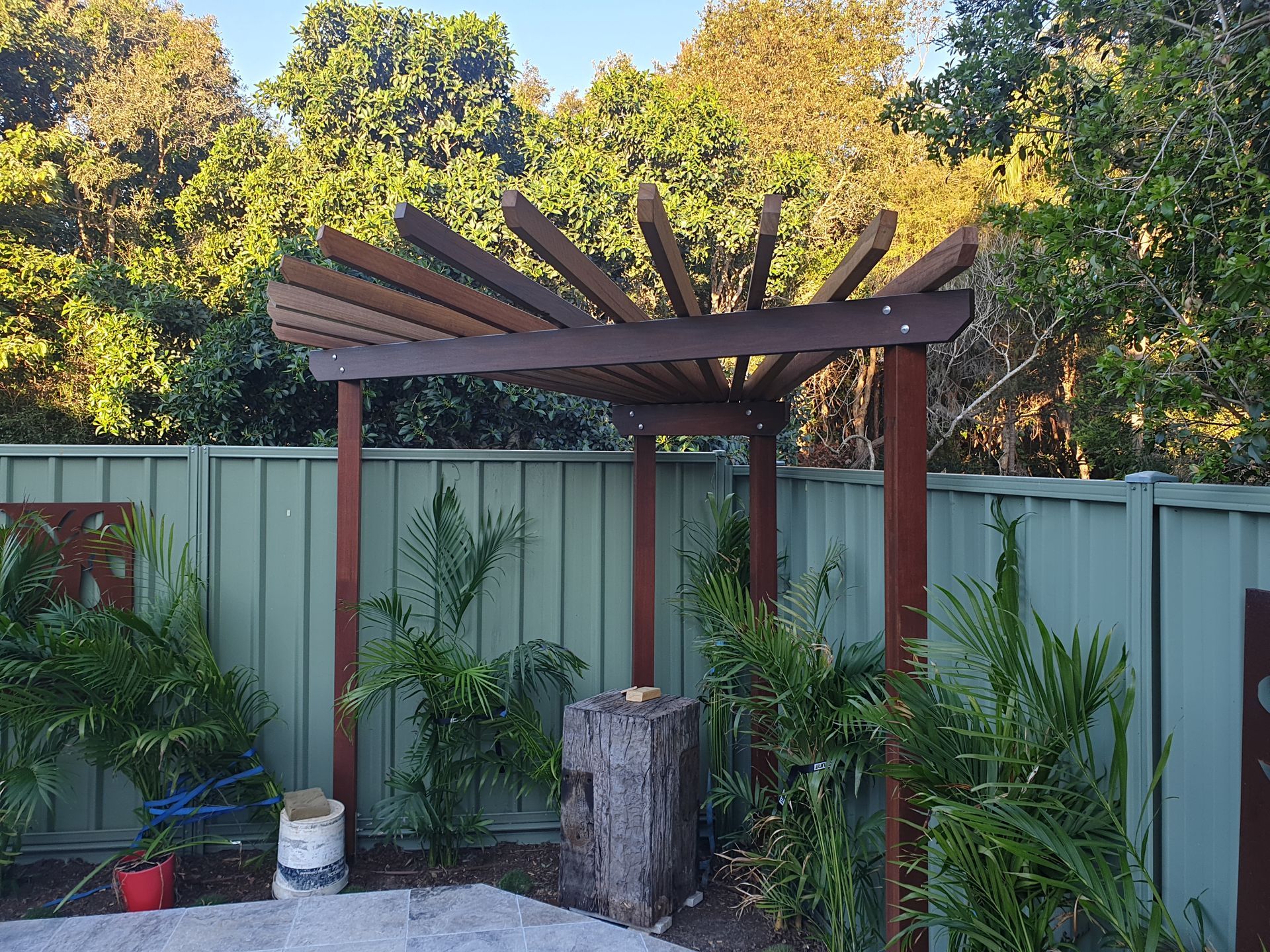 A garden has been newly landscaped with a tall metal design in the garden as a feature — Tim Williams Landscapes in Wollongbar, NSW